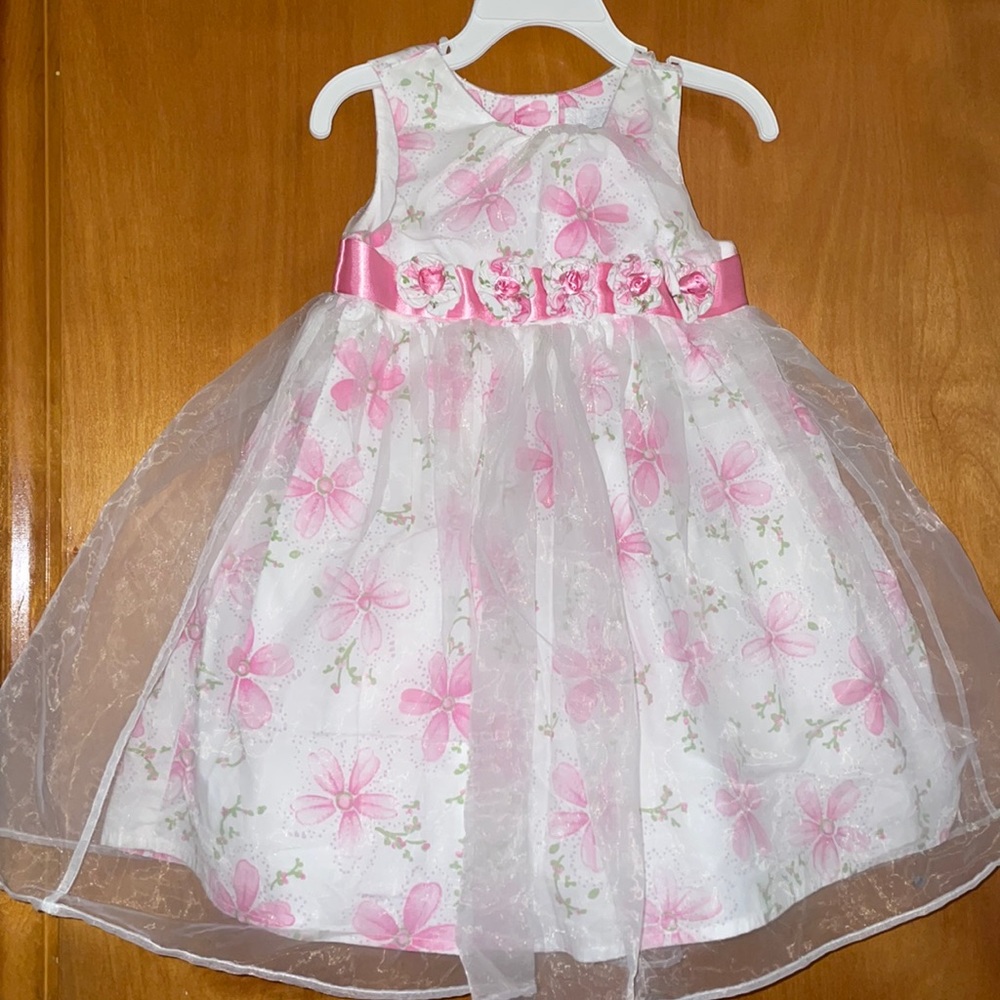 Beautiful pink floral layered party dress with rosettes on pink belt